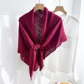 Close-up of burgundy hollow-out knitted shawl with delicate textured patterns - Burgundy