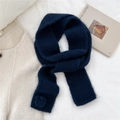 Detail of navy knit scarf featuring soft texture and 3D floral accent in a cozy layout - Scarf / Navy Blue