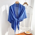 Close-up of royal blue knitted shawl featuring hollow geometric mesh texture and soft drape - Sapphire Blue