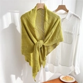 Detail of green knitted triangle shawl showing hollow mesh texture and striped pattern - Yellow-Green
