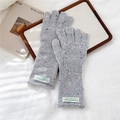 Detailed knit texture of grey speckled gloves with ribbed cuffs and woven brand labels - Confetti Grey