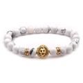 White marble beaded lion head bracelet with gold accents on a clean white background - White Turquoise With Rhinestone