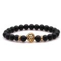 Macro detail of black matte beaded bracelet featuring a golden lion head and crystal rings - Matte Black Stone With Rhinestone