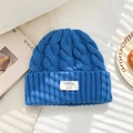 Close-up of royal blue 100% wool knit hat showing thick cable pattern and brand label - 25*22cm / Royal Blue