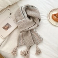 Detail shot of boho knit scarf featuring pastel wave patterns and thick yarn tassels - Thickened Tassel Ethnic Beige