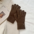 Close-up of dark brown knitted gloves with elongated ribbed cuffs on soft wool background - One Size / Brown