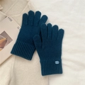Detailed close-up of dark blue knit gloves featuring warm ribbed cuffs and a textured weave - One Size / Deep Sea Blue