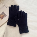 Close-up of black knitted winter gloves featuring soft texture and ribbed wrist cuffs - One Size / Navy Blue