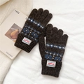 Detail of dark brown knit gloves featuring vintage geometric patterns and ribbed cuffs - One Size / Dark Coffee