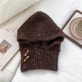 Close-up of dark brown chunky knit balaclava with decorative wooden toggle buttons - Brown Flecked