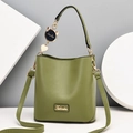 Minimalist green leather bucket bag with top handle and crossbody strap for women - Matcha Green