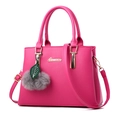 Chic rose red leather handbag with shoulder strap and decorative grey fur pompom charm - Rose Red