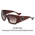 Lunettes de soleil oversize marron thé pour femmes avec détails anneaux dorés latéraux - Monture Thé Transparente Verres Double Marron