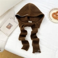 Detail of dark brown knitted hood scarf featuring white contrast hand-stitched edging - Caramel color