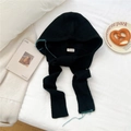 Close-up of black knitted hooded scarf with contrast teal stitching and soft texture - Black