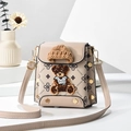 Beige crossbody bag with plush bear in knit hat and floral monogram pattern - Light Khaki/Print