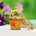 Golden bucket keychain with ingots and sparkling rhinestones for wealth and luck - Yellow Treasure Bowl