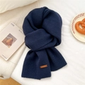 Detail of navy blue ribbed knit scarf with a premium brown leather logo patch - 31*187cm / Navy Blue