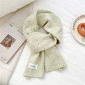 Detail of light green knit scarf with colorful specks and brand label on flat lay - 23*160cm / Light Green