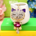 Cat keychain with rose red gemstone body and white rhinestones in gold plating - Purple Lucky Cat