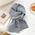 Close-up of soft grey knit scarf texture featuring a brown leather brand tag detail - 31*187cm / Light Gray