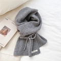 Detail view of grey knit scarf showing ribbed texture and decorative ribbon bow - Gray with Bowknot