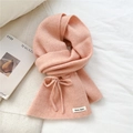 Close-up of pink ribbed knit scarf detail with bow accent and branded fabric label - Pink Bowknot