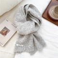 Close-up of light gray wool knit scarf with soft texture and brand label detail - Light Gray