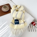 Detail of wool blend striped scarf with brand patch and decorative soft tassels - Yellow and Gray Striped