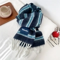Detailed close-up of a thick striped wool scarf with navy blue and white fringe - Navy and Blue Striped