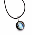 Close-up of a handmade galaxy glass ball pendant featuring a nebula on a black cord - Space