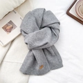 Detail showing the gray knitted scarf with a premium leather patch and soft texture - Light Grey(10)