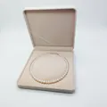 Detail of elegant white pearl necklace inside a soft beige velvet jewelry gift box - Round Necklace Box 19*19*4CM / Off White