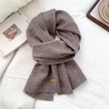 Detail of mocha knitted scarf showing soft texture and premium leather logo patch - Dark Coffee(11)