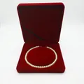Detailed view of a white pearl necklace inside a luxury red velvet jewelry gift box - Round Necklace Box 19*19*4CM / Burgundy