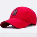 Classic red cotton baseball cap with a grey leather patch logo for outdoor sports - Red