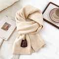 Close-up of beige knit scarf texture with handmade label on soft cotton background - One Size / Heathered Oatmeal