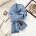Detailed texture of Morandi blue knitted scarf with a premium leather handmade label - One Size / Heathered Blue