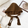 Detailed knit texture of a brown integrated hood scarf with woven brand label detail - Brown