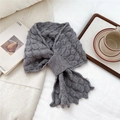 Close-up of gray fish-scale knit scarf with pull-through loop on soft white fabric - Gray