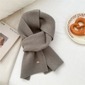 Light gray knitted wool scarf with ribbed texture and small oval decorative label - Mocha