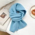 Light blue wool knit scarf with thick textured pattern and stylish small brand tag - Sky Blue