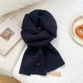 Classic black knitted wool scarf with vertical rib texture and premium brand tag detail - Navy Blue
