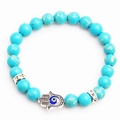 Blue turquoise beaded bracelet with Hamsa Hand and Evil Eye charm on white background - Silver Pendant Sky Blue Bead
