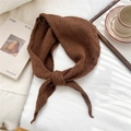 Detail of soft brown knit scarf with hollow texture on a white fabric background - 55cm*55cm*100cm / Brown