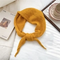 Detail of ginger yellow knitted hollow crochet scarf in a cozy lifestyle setting - 55cm*55cm*100cm / Yellow