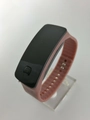 Close-up of pink silicone strap with anti-slip texture and LED touch screen display - Coffee