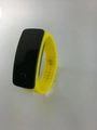 Detail view of bright yellow silicone sports watch with rectangle LED screen and metal buckle - Yellow