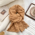 Close-up of caramel knitted scarf featuring thick fish-scale pattern and wavy edge detail - 20x140cm / Camel