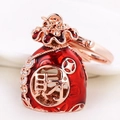 Lucky money bag keychain with red enamel, crystal rhinestones, and Cai character - Burgundy Lucky Bag
